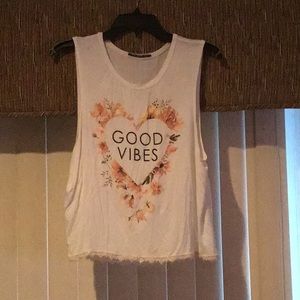 Cute tank top. Says Good Vibes.